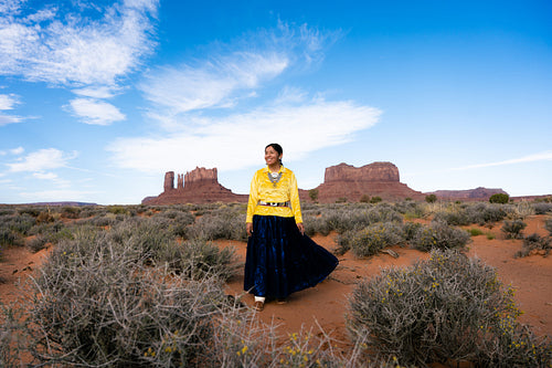 Young Native youth wearing traditional clothing and regalia outs