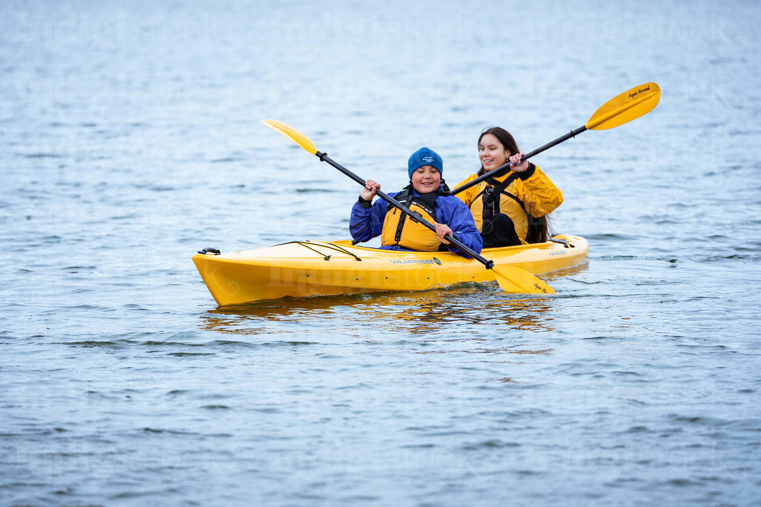 Indigenous family going kayaking 