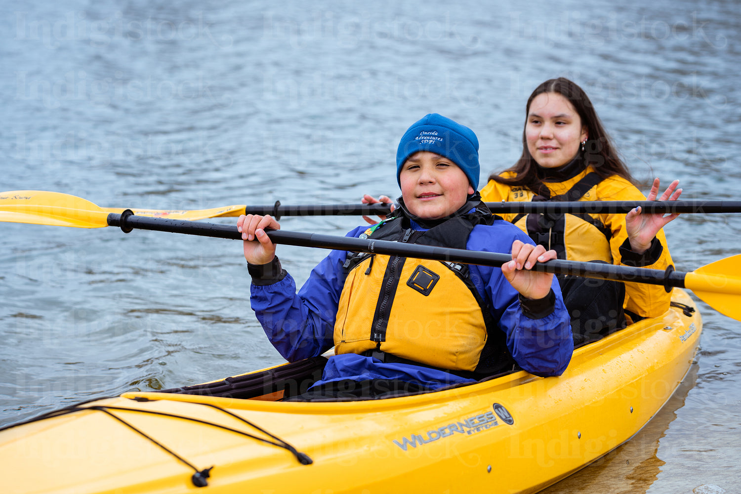 Indigenous family going kayaking 