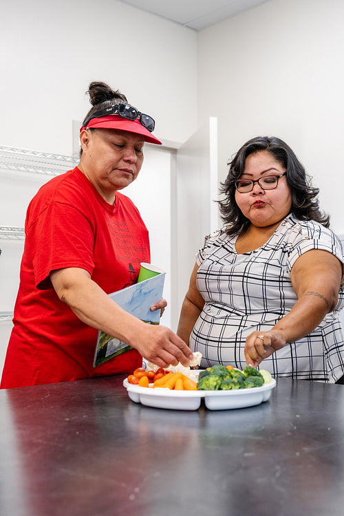 Native Peoples participating in a cooking class