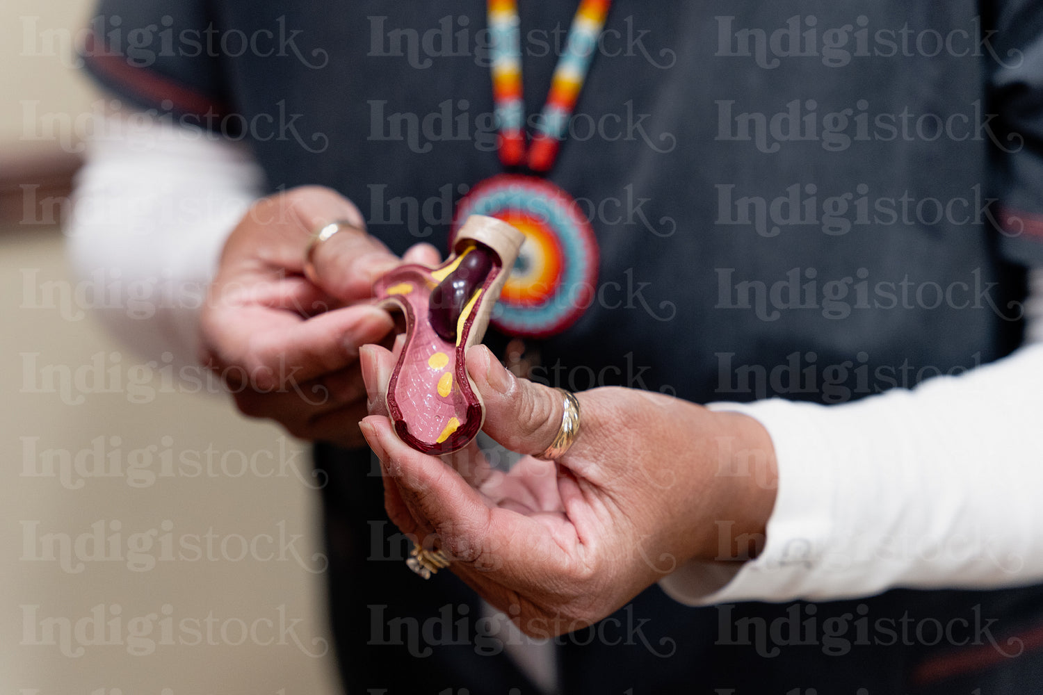 An Indigenous man being check by a native health care nurse