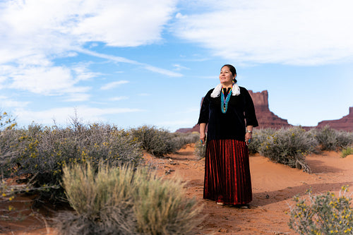 A Native woman wearing traditional regalia