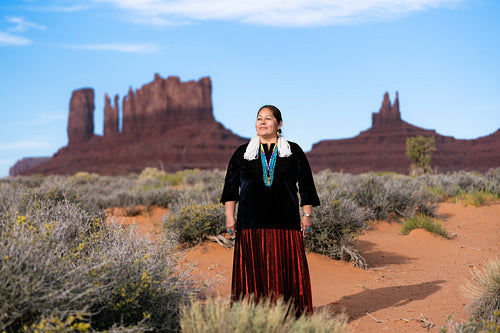 A Native woman wearing traditional regalia