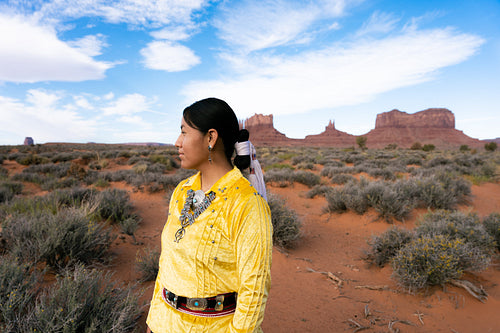 Young Native youth wearing traditional clothing and regalia outs