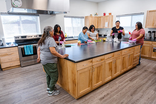 Native Peoples participating in a cooking class