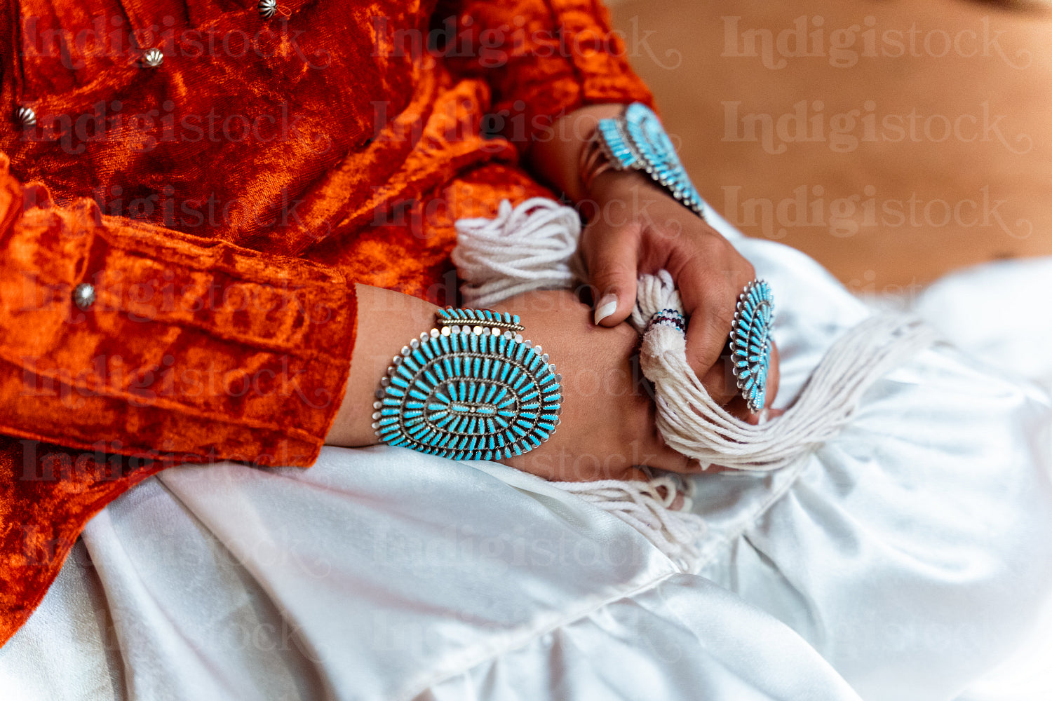 Native Women wearing traditional regalia in Earth Lodge