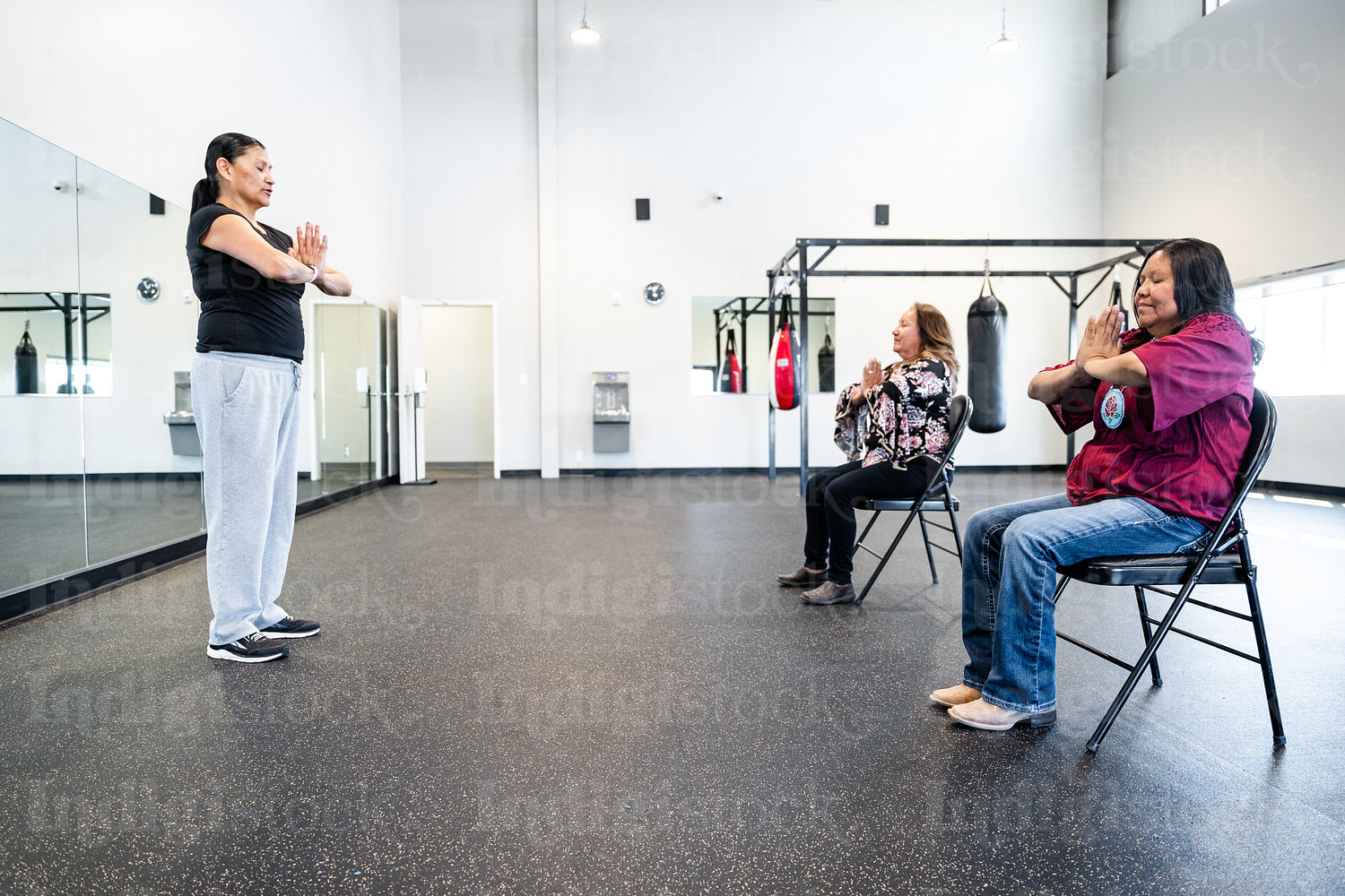 Native woman learning from an instructor 