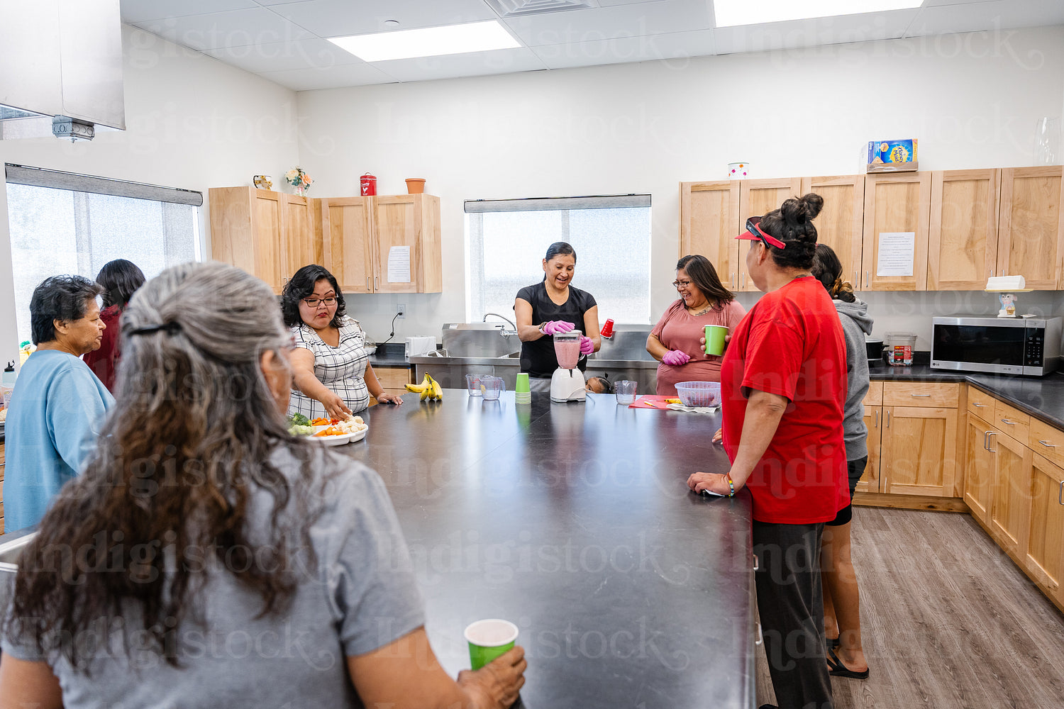 Native Peoples participating in a cooking class