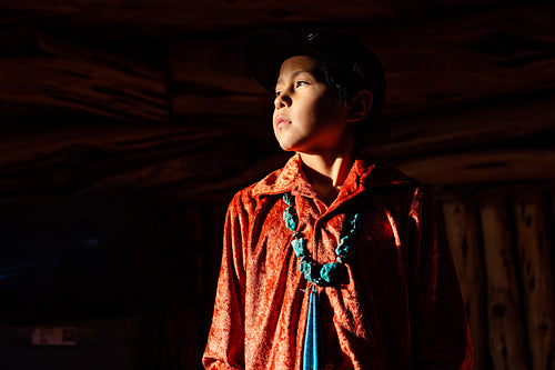 Native American children wearing traditional regalia