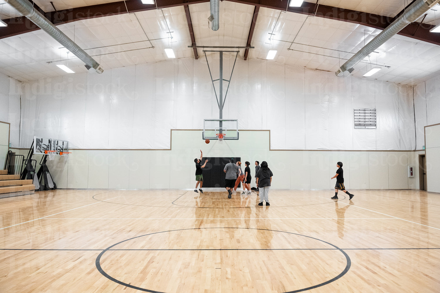 A Native family playing a game of basketball 