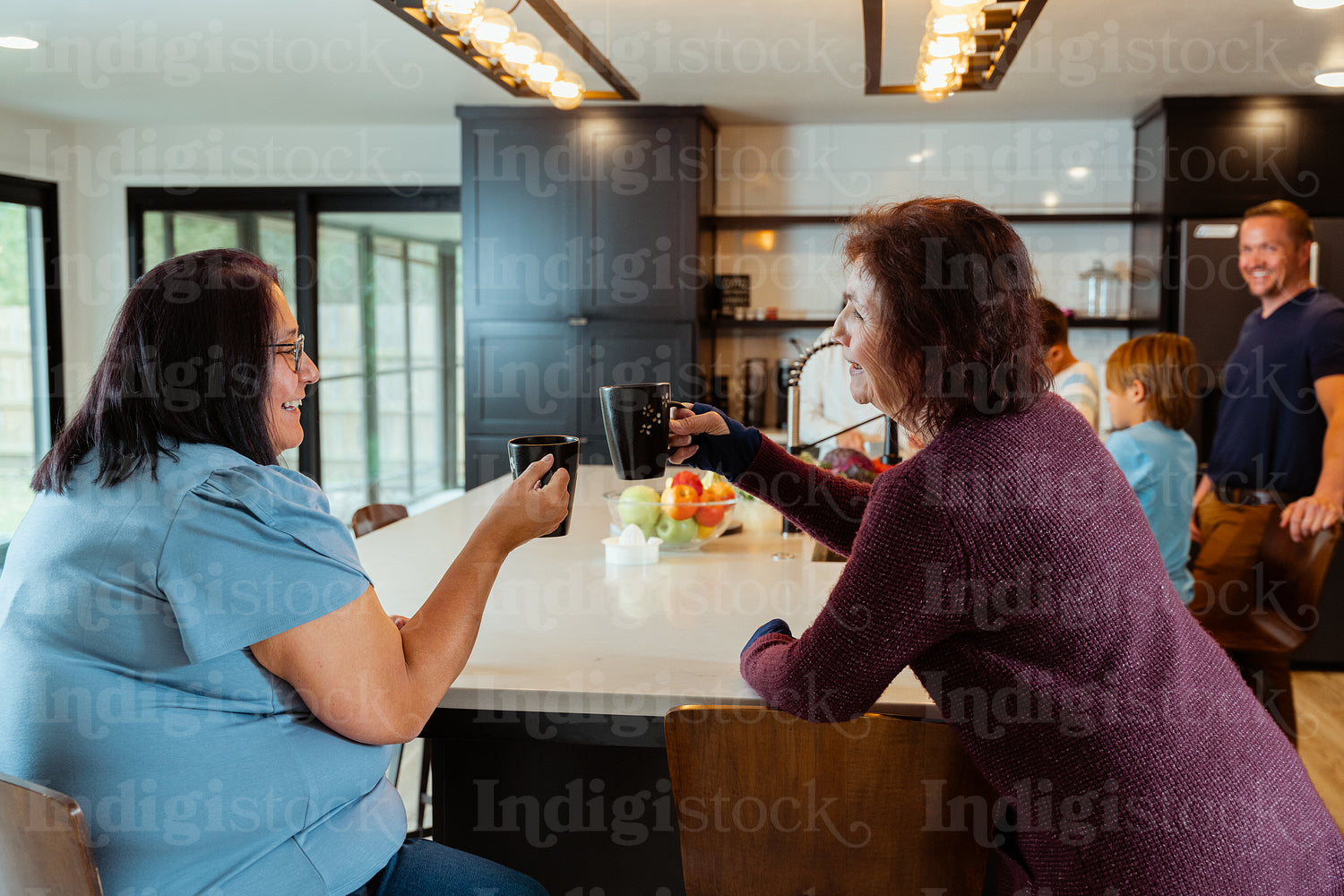 Two native women enjoying coffee together