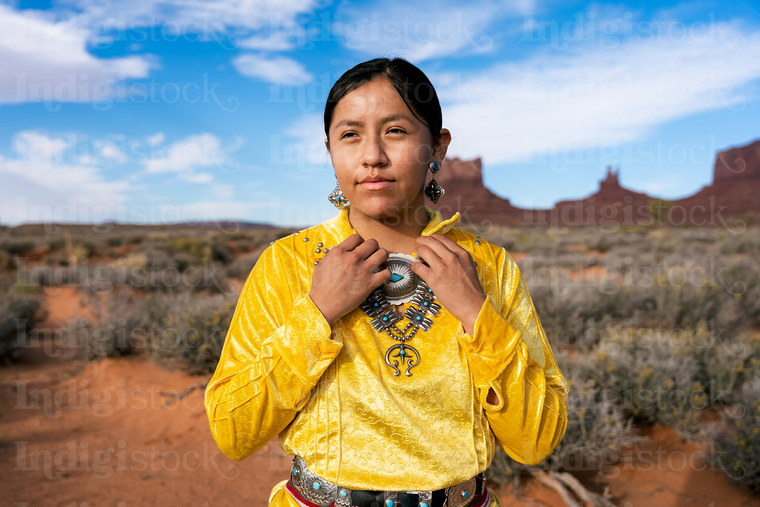 Young Native youth wearing traditional clothing and regalia outs