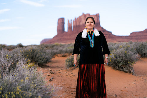 A Native woman wearing traditional regalia