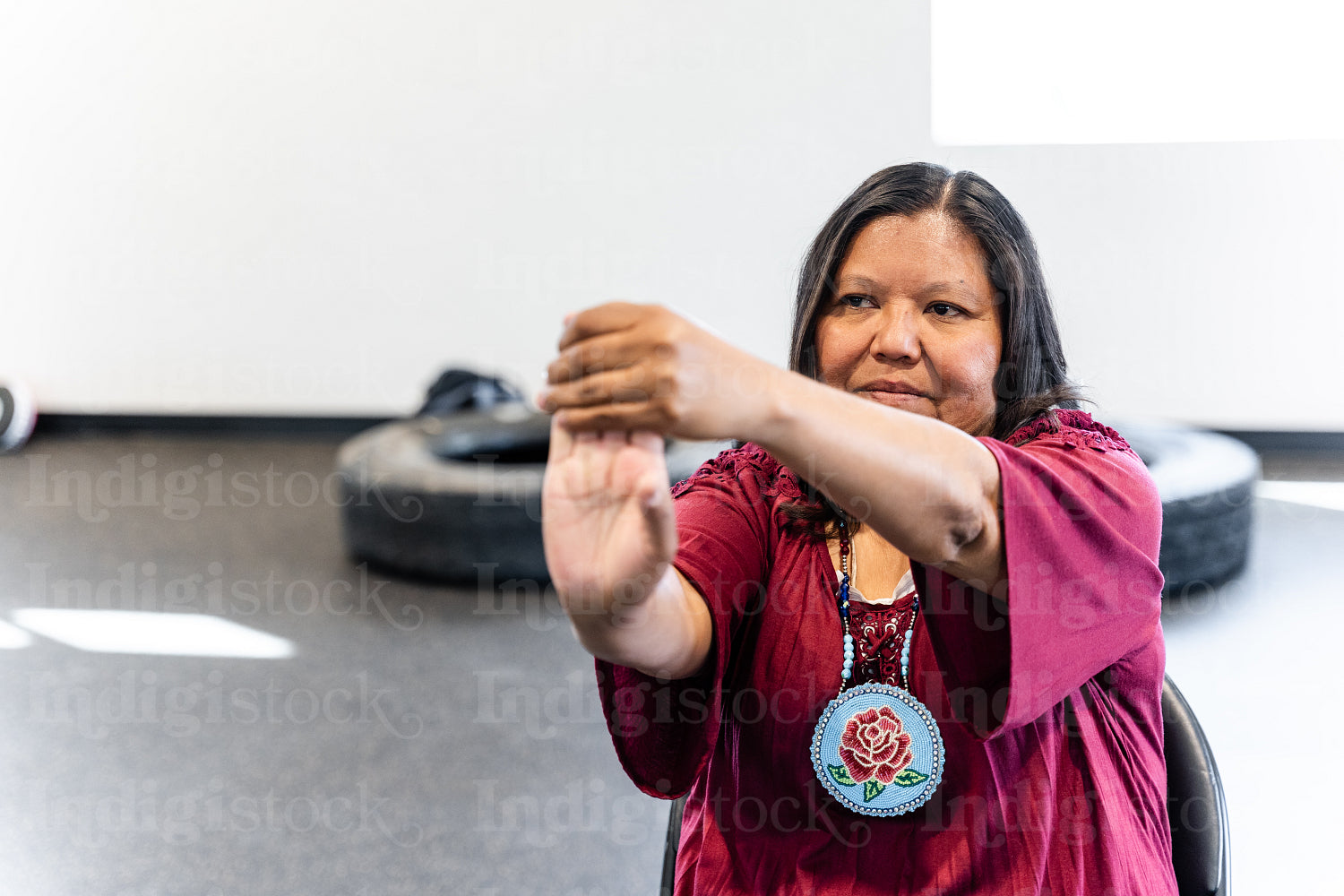 Native woman learning from an instructor 