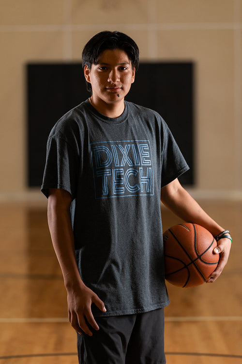 Native youth playing basketball