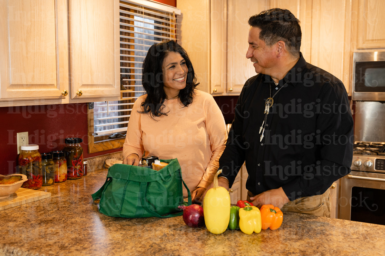 Indigenous couple preparing dinner