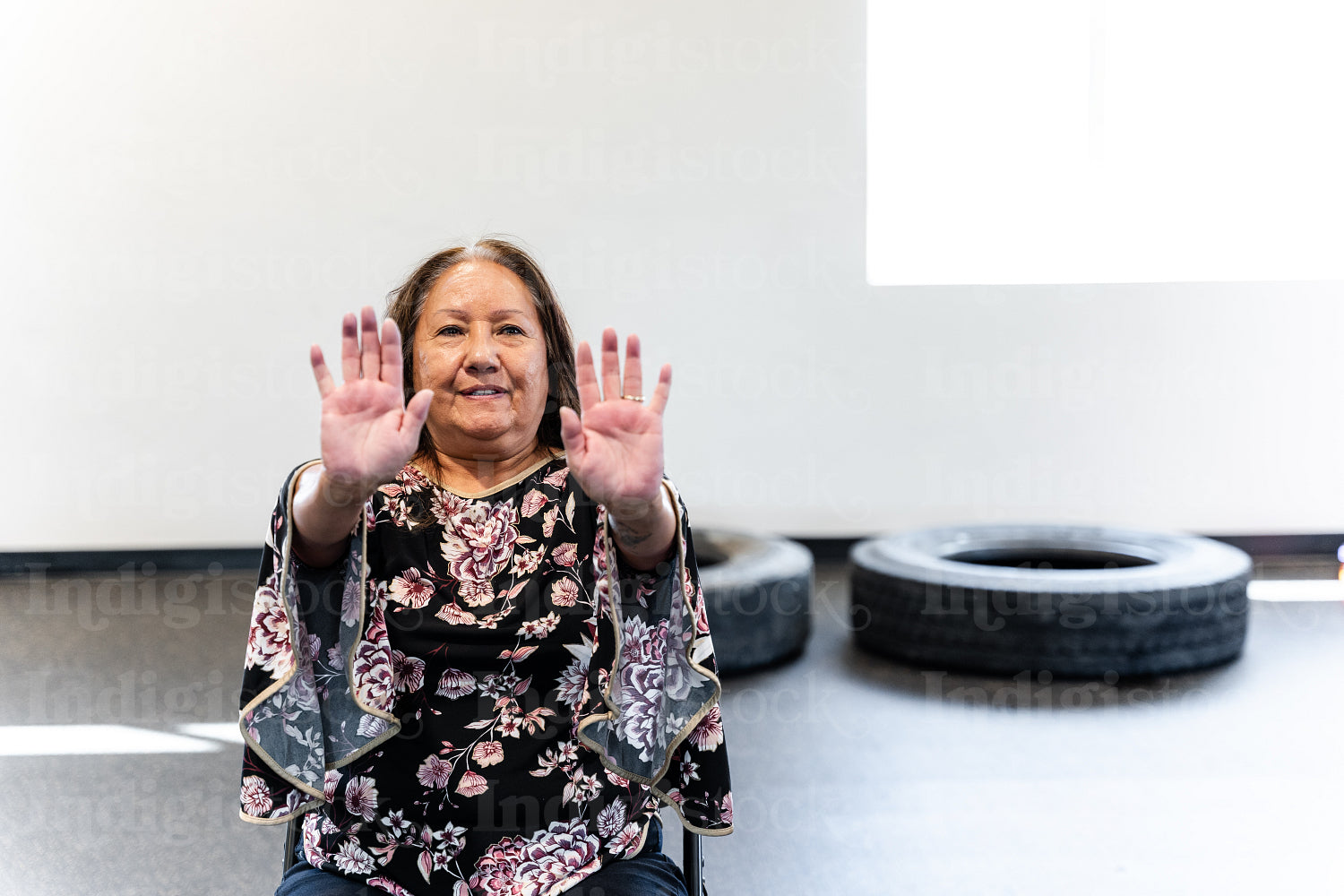 Native woman learning from an instructor 