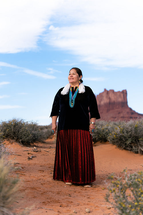 A Native woman wearing traditional regalia