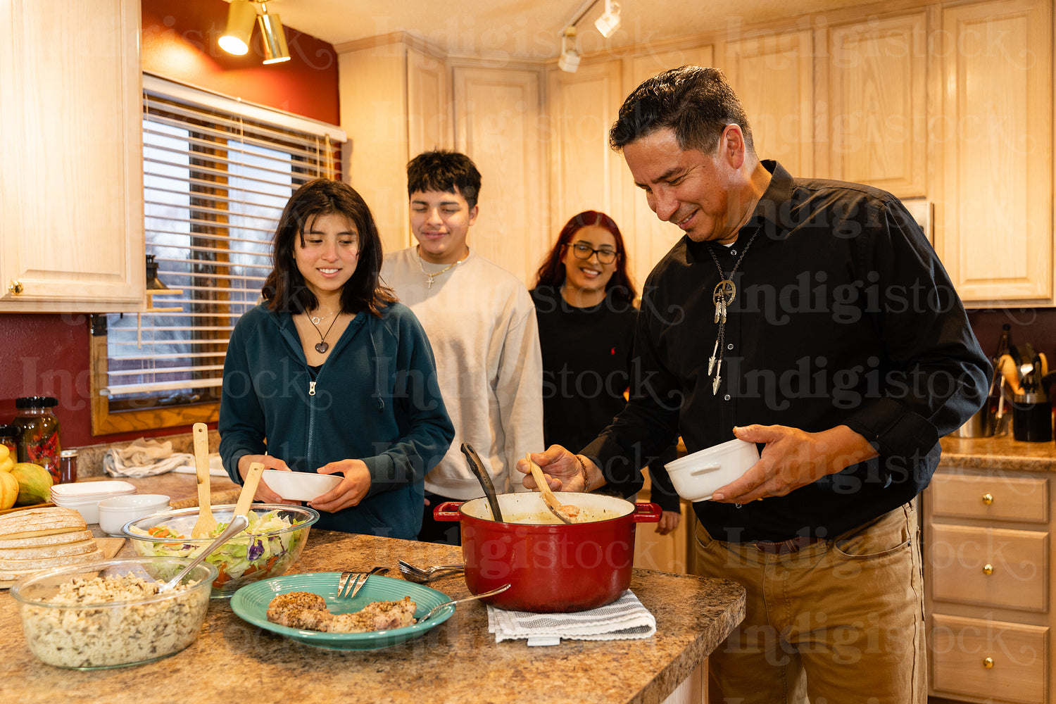 Indigenous family making a meal together