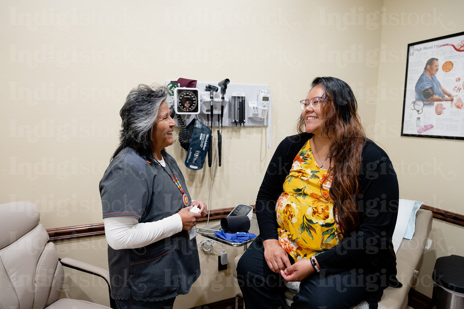 A native woman getting checked by an indigenous nurse 