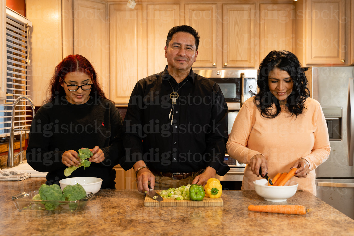 Indigenous family making a meal together