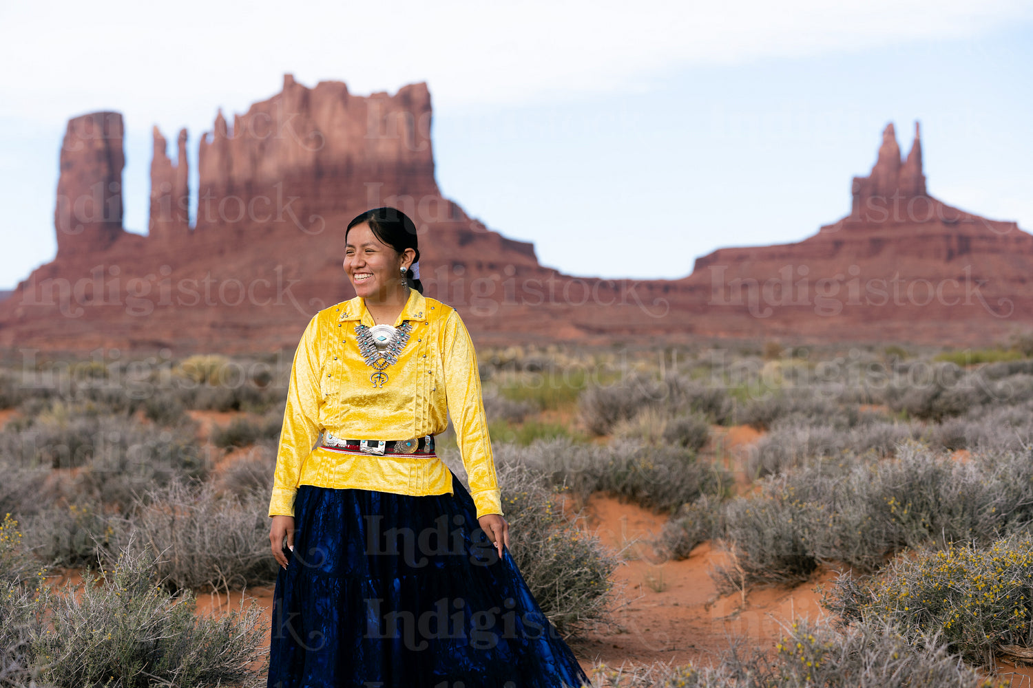 Young Native youth wearing traditional clothing and regalia outs