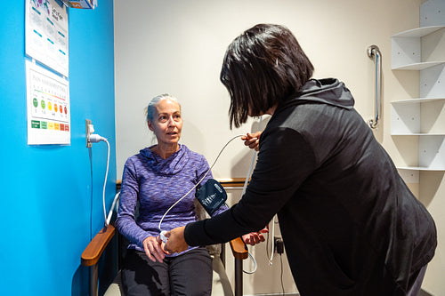 A native elder getting a health checkup at a health center