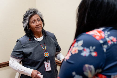 A native woman getting checked by an indigenous nurse