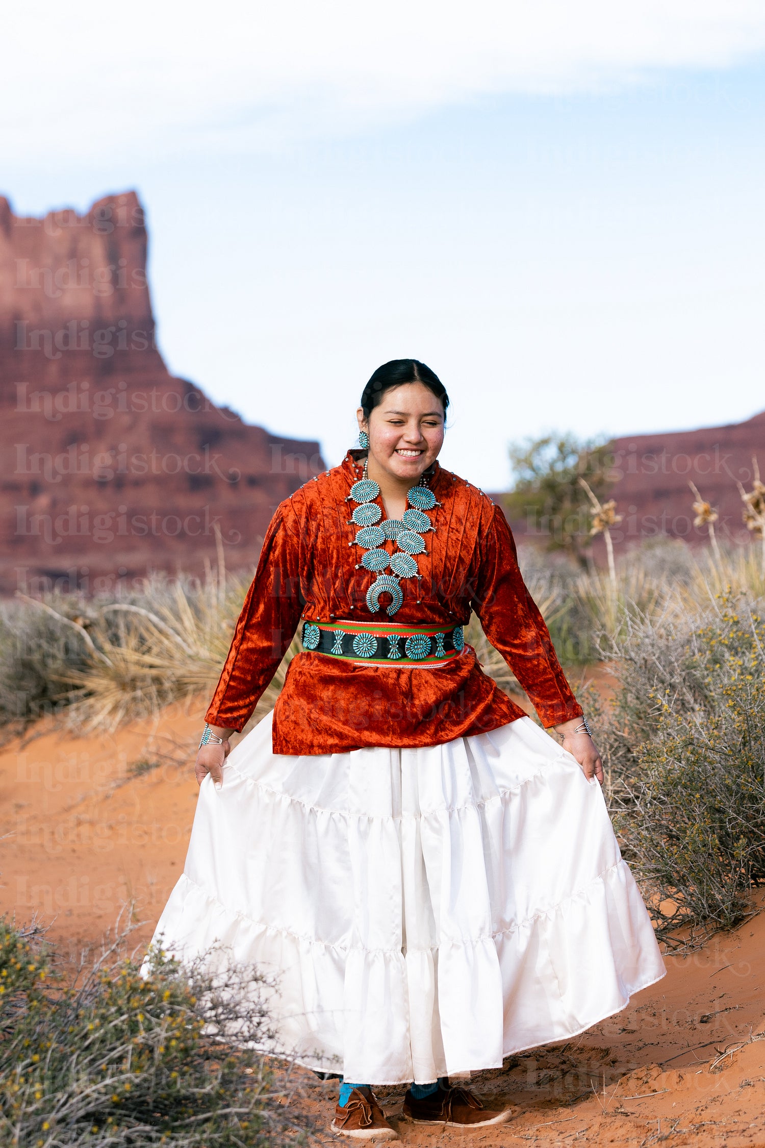 Young Native youth wearing traditional clothing and regalia outs