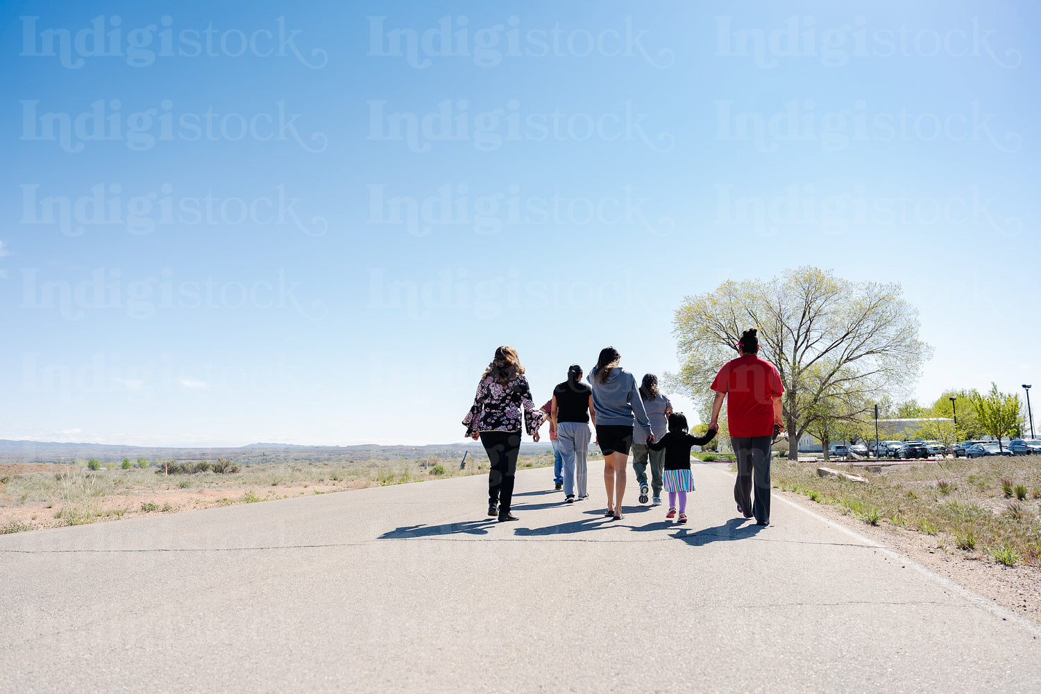 A Native family going on a walk outside 