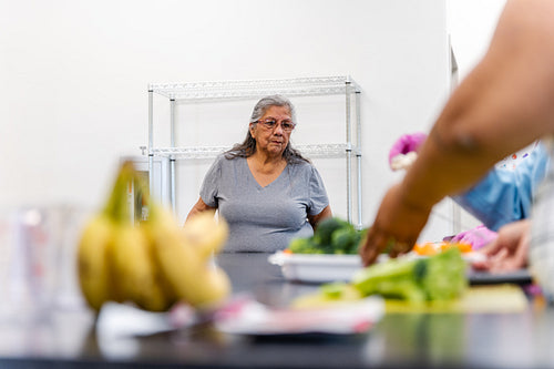 Native Peoples participating in a cooking class