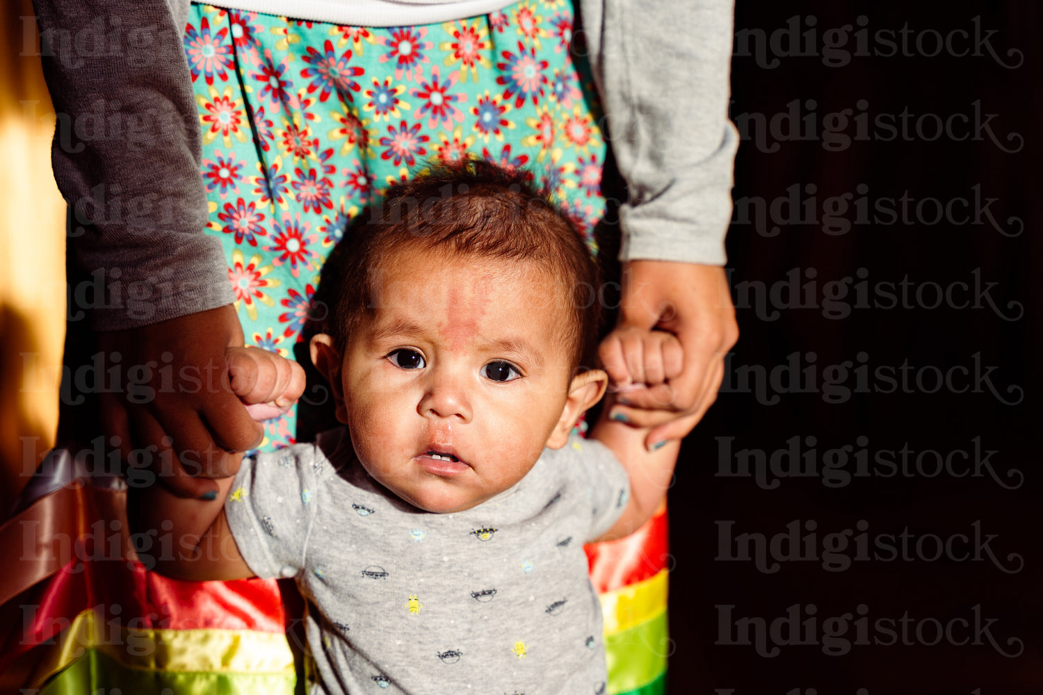 Native American children wearing traditional regalia 