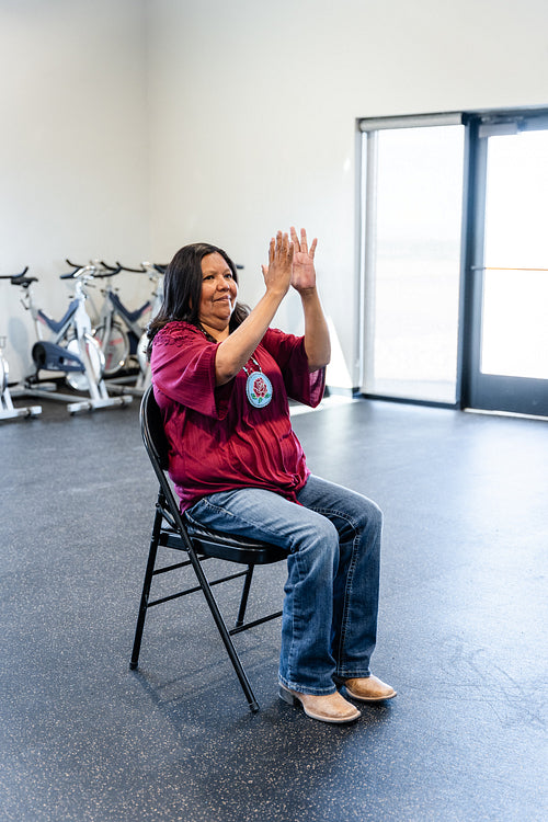 Native woman learning from an instructor