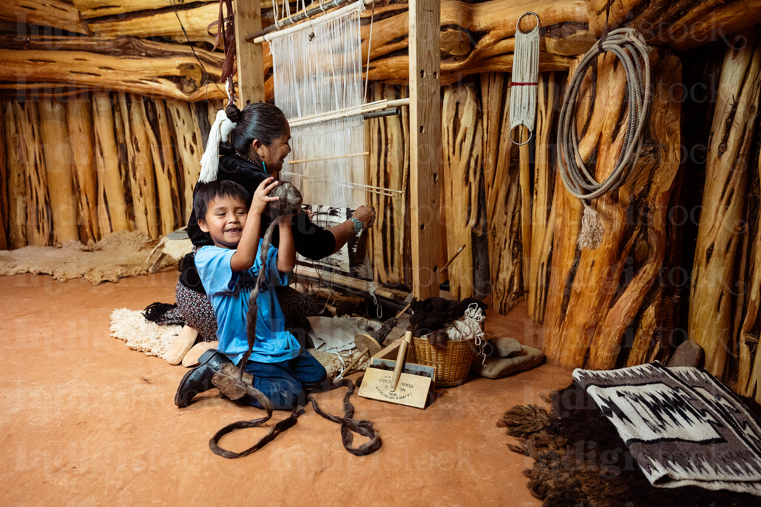 Native Elder showing younger generation the process of tradition