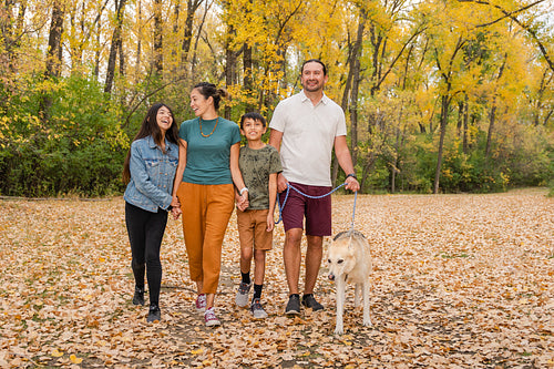 Indigenous family taking a walk in the woods