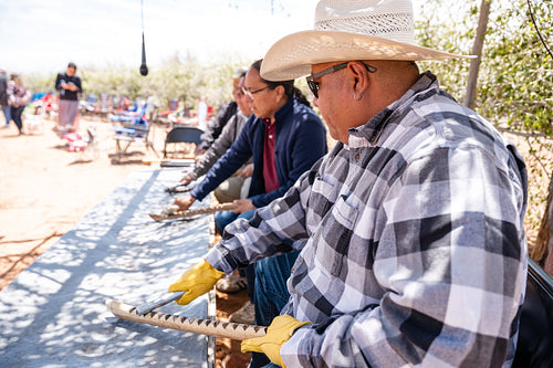 Native men singing songs and playing instruments