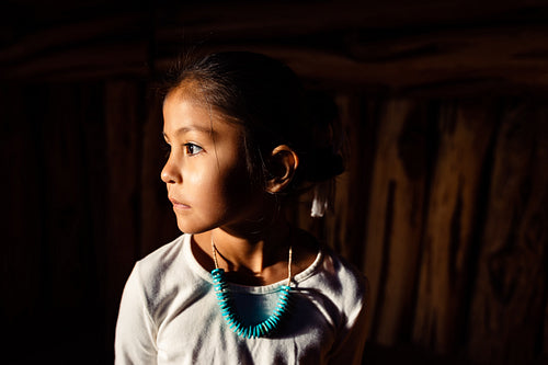 Native American children wearing traditional regalia