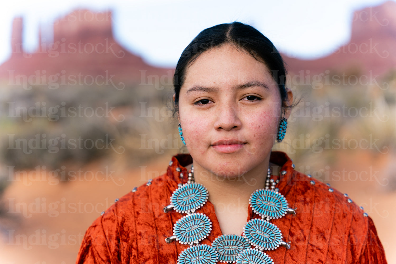 Young Native youth wearing traditional clothing and regalia outs