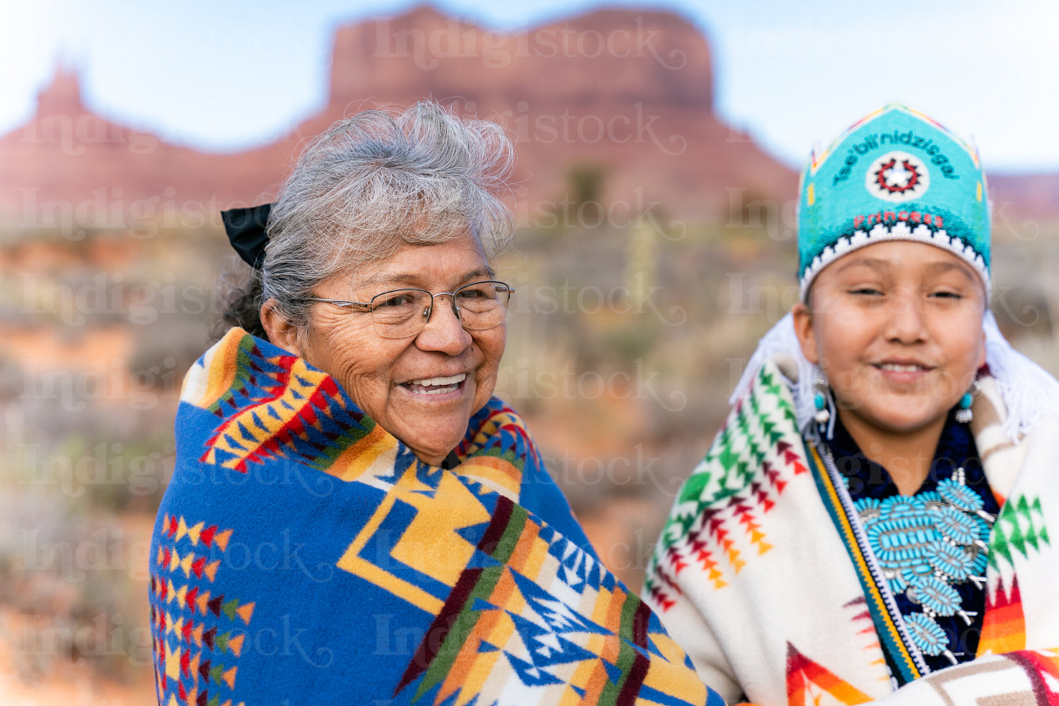 An indigenous elder with the younger generation wearing traditio