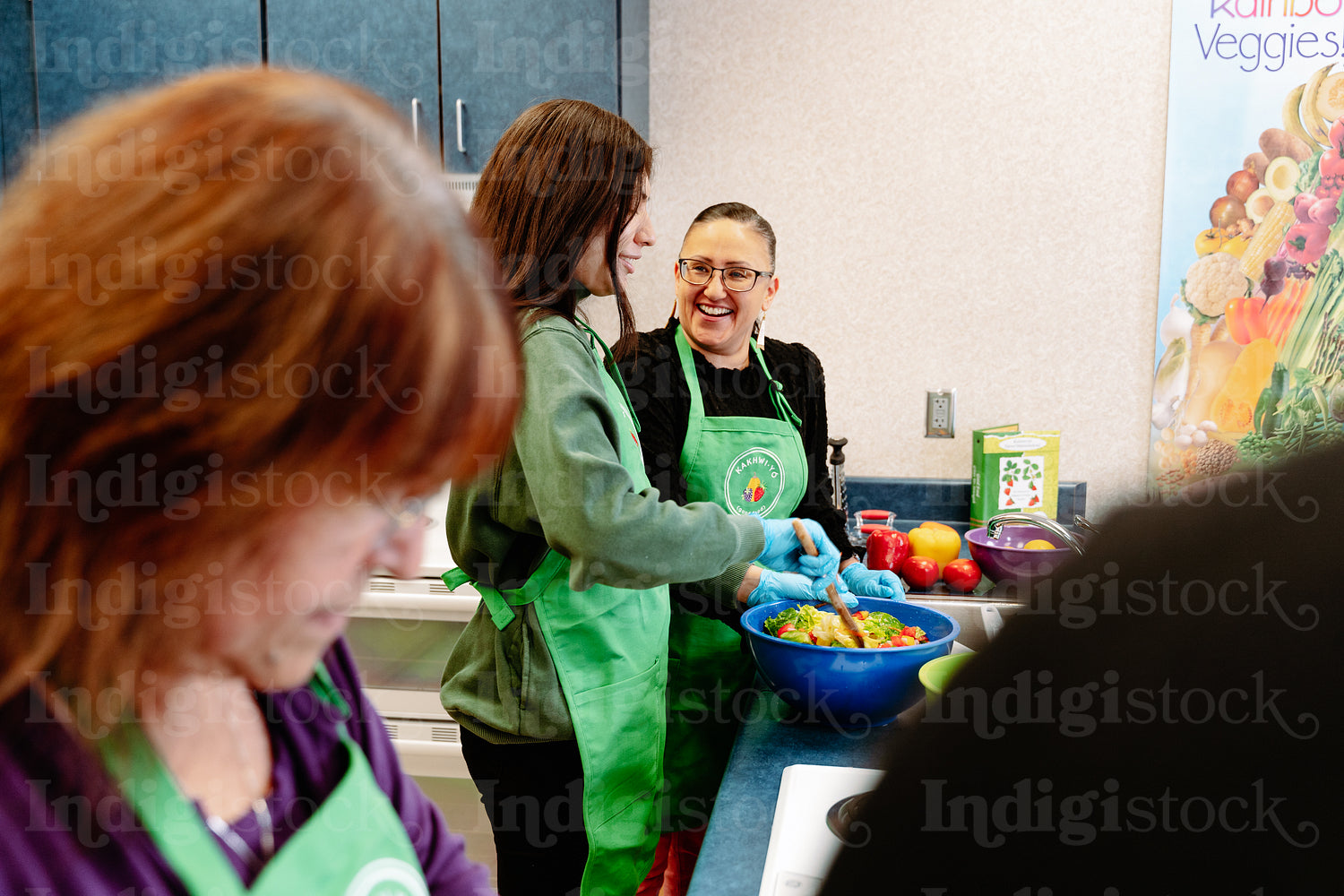 Indigenous Peoples making a meal together