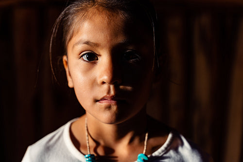 Native American children wearing traditional regalia