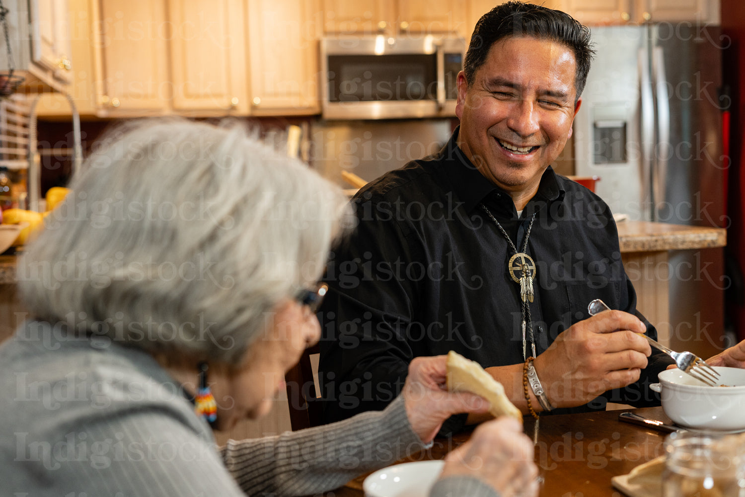 Indigenous family sharing a meal