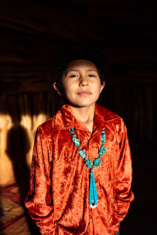 Native American children wearing traditional regalia