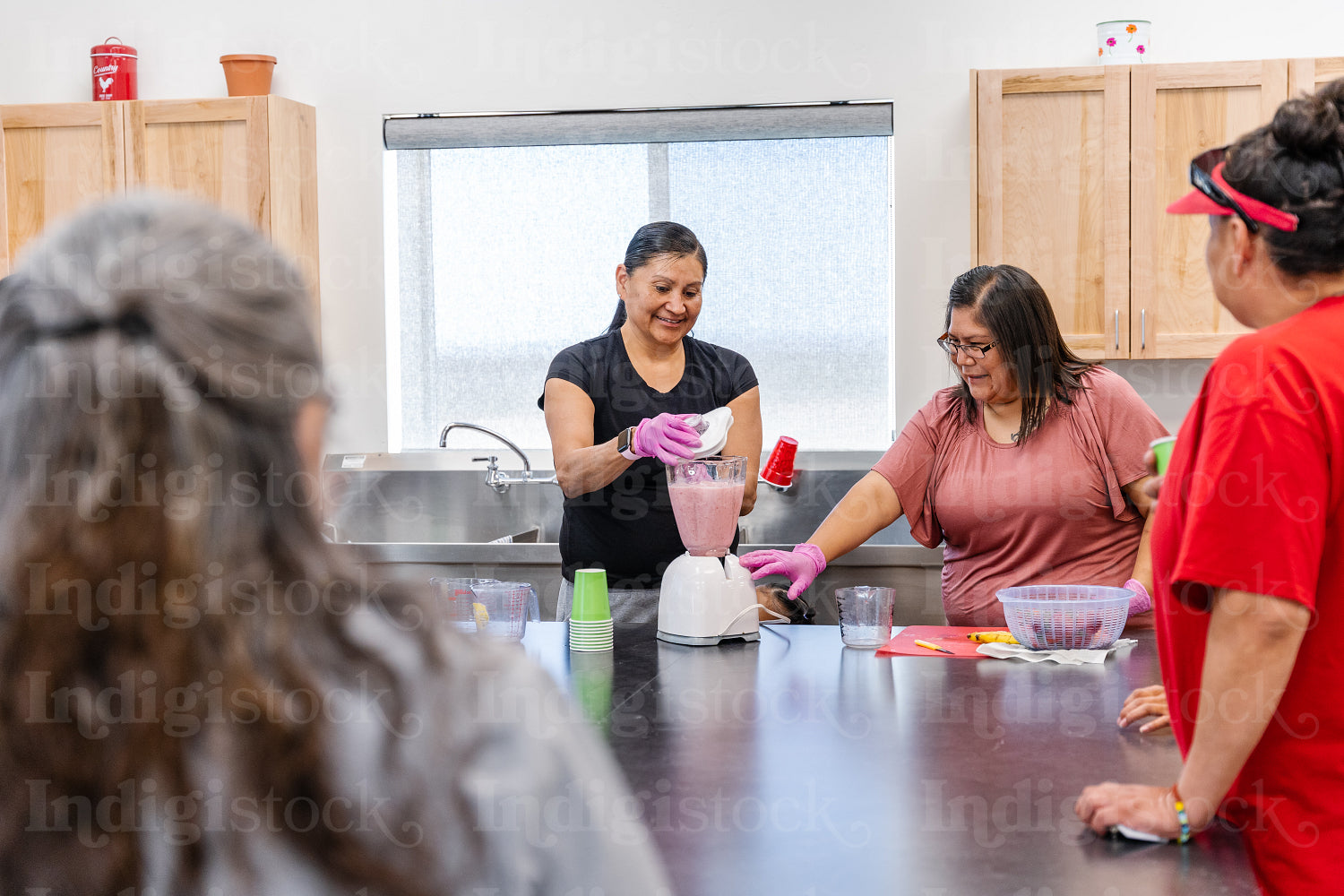 Native Peoples participating in a cooking class