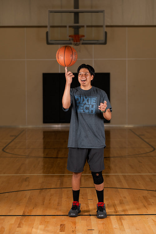 Native youth playing basketball