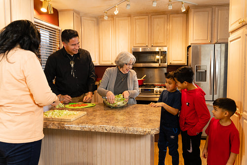 Indigenous family making a meal together