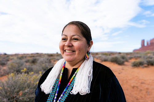 A Native woman wearing traditional regalia