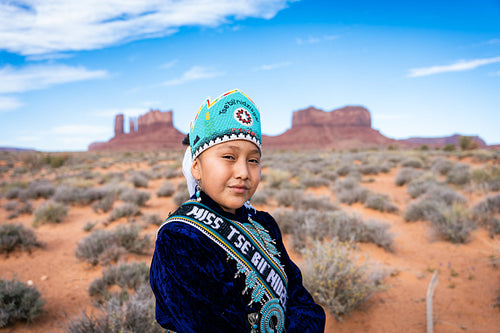 Native youth wearing traditional clothing and regalia