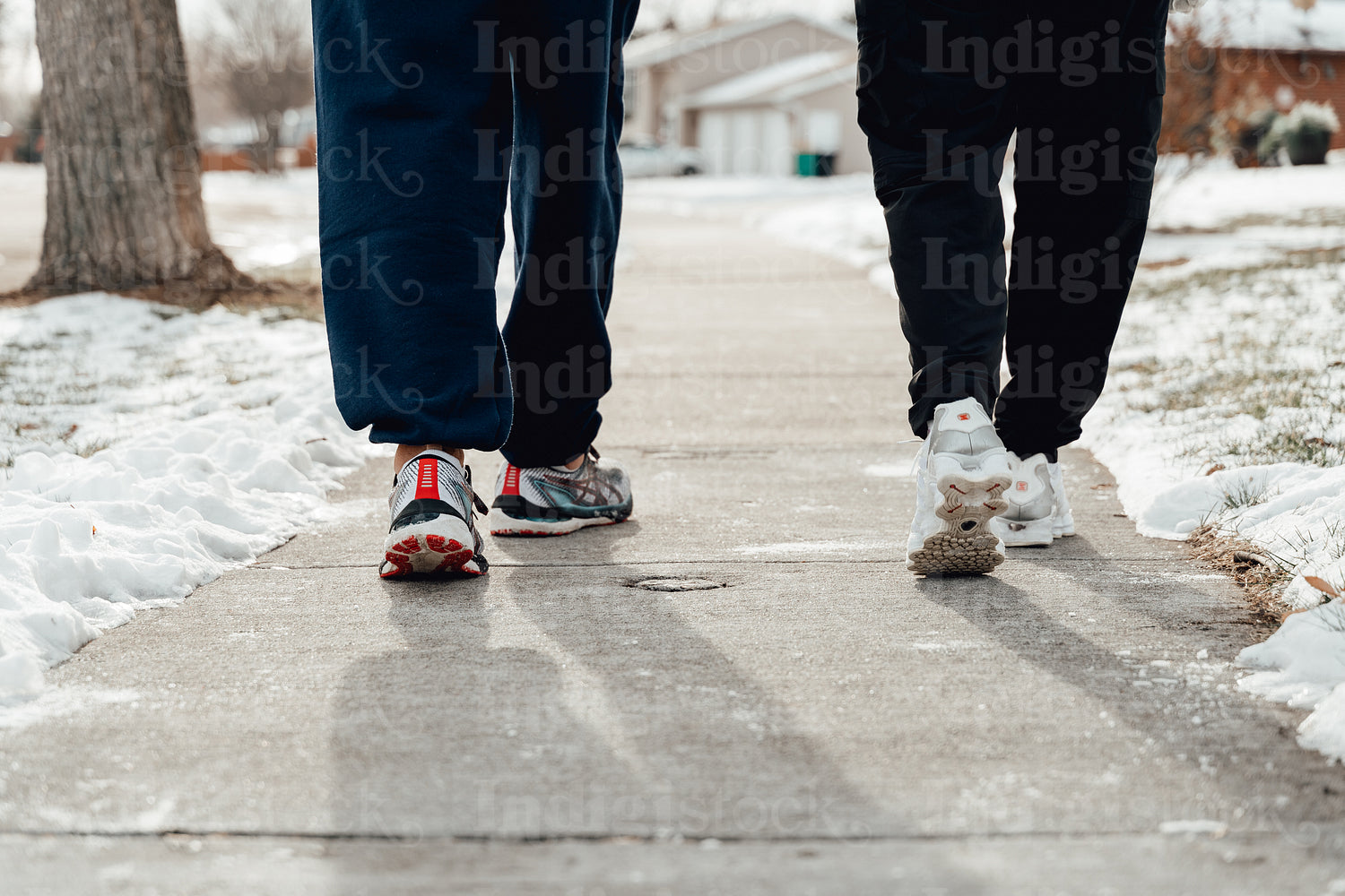 Indigenous couple walking through snow