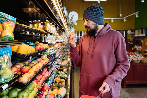 Indigenous man grocery shopping